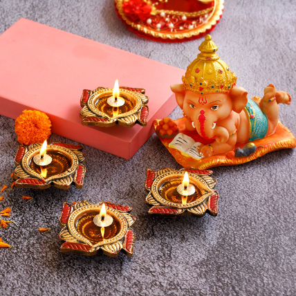 4 Swastik Diyas and Cute Bal Ganesha Idol