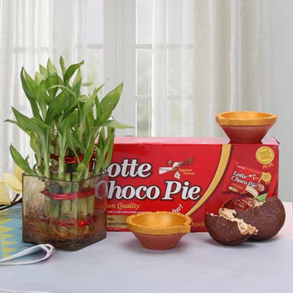 Prosperous Diwali Diyas With Bamboo Plant And Choco Pie