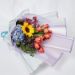 vibrant mixed flowers wrapped bouquet