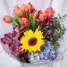 vibrant mixed flowers wrapped bouquet